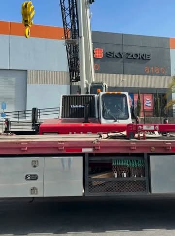 Boom crane on site for a commercial HVAC installation at Sky Zone